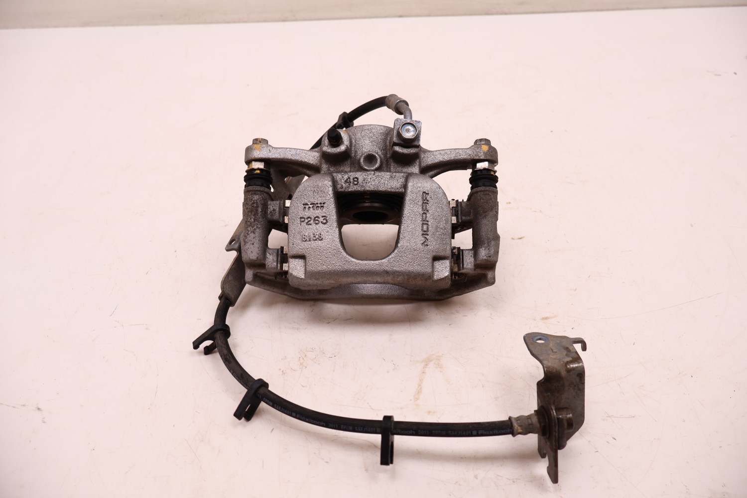 JEEP WRANGLER JL 2.2 MTJ 18- ZACISK HAMULCA LEWY TYŁ 55087A0