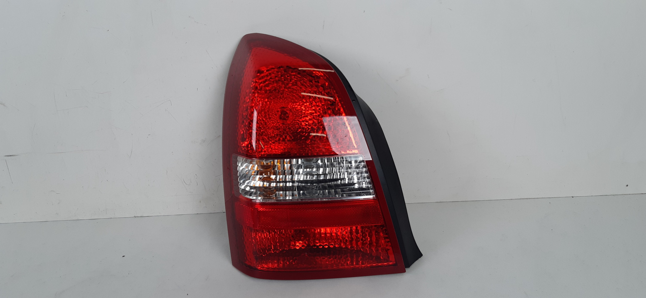 NISSAN PRIMERA P12 LAMPA LEWA TYŁ 89077082