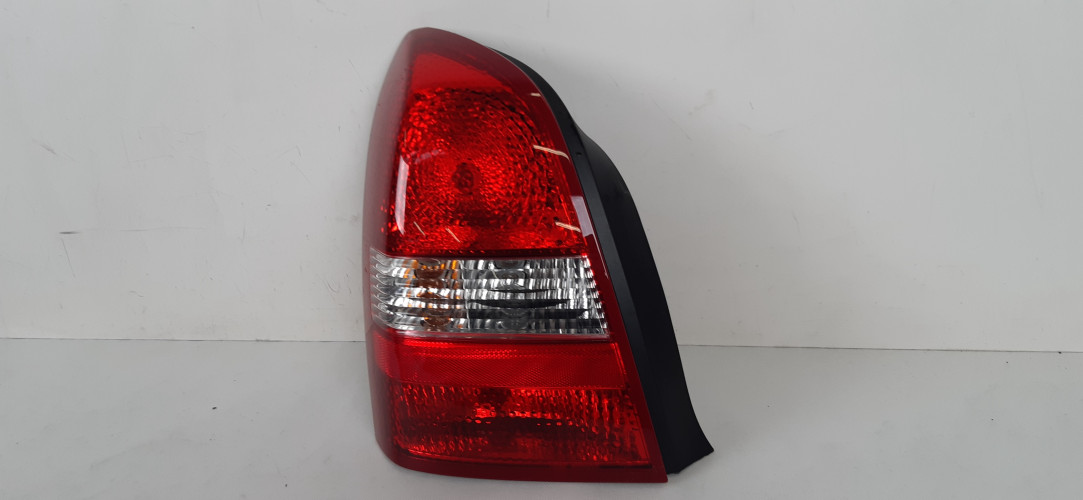 NISSAN PRIMERA P12 LAMPA LEWA TYŁ 89077082