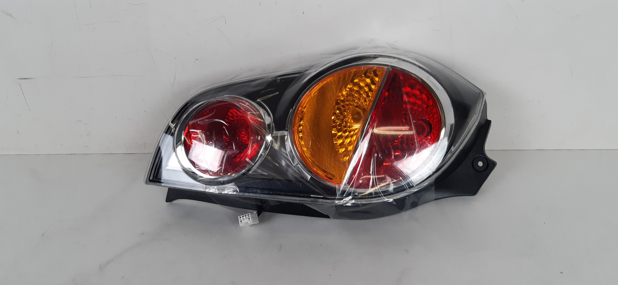 CHEVROLET SPARK LAMPA LEWA TYŁ 42577163, 42577161